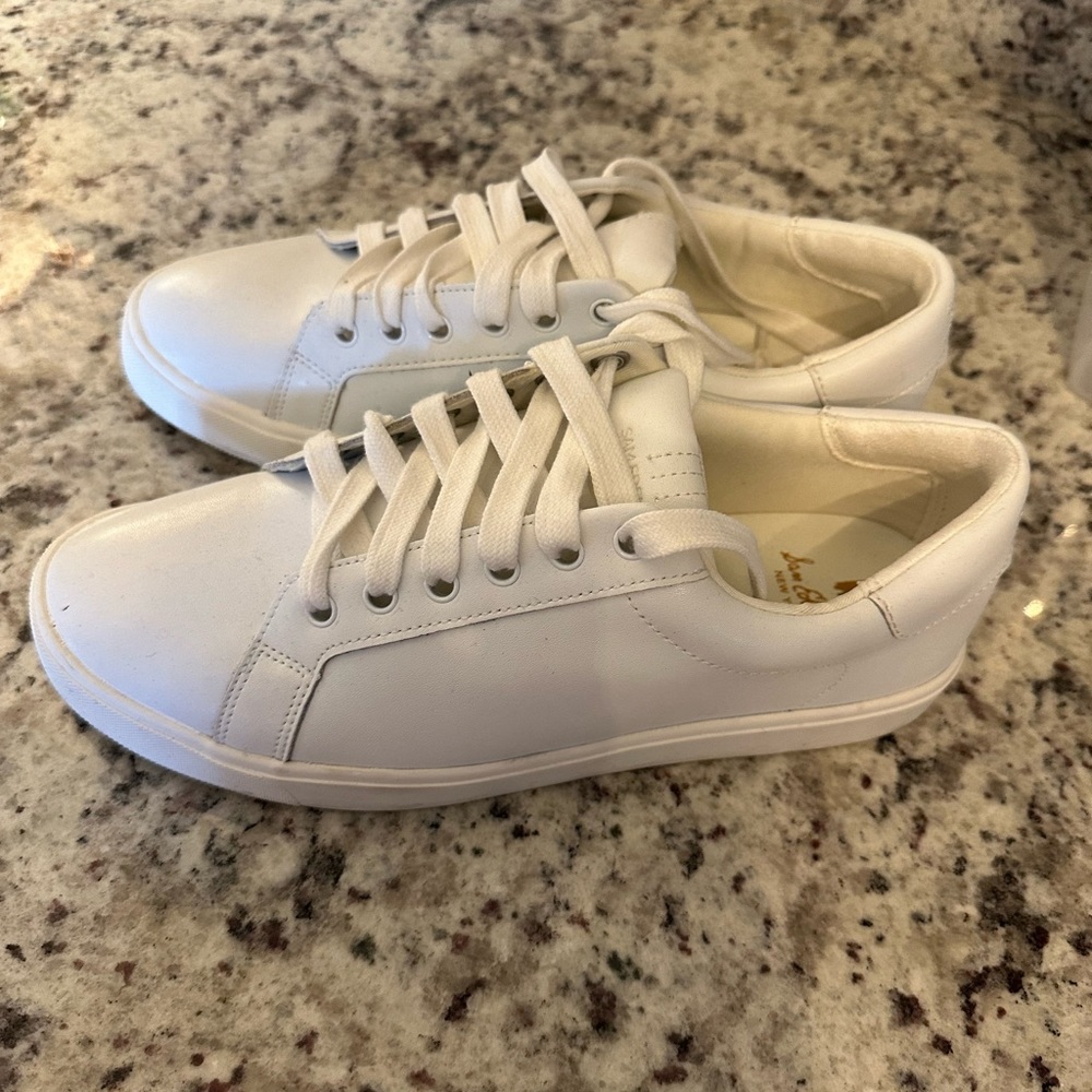 White leather Sam Edelman tennis shoes.